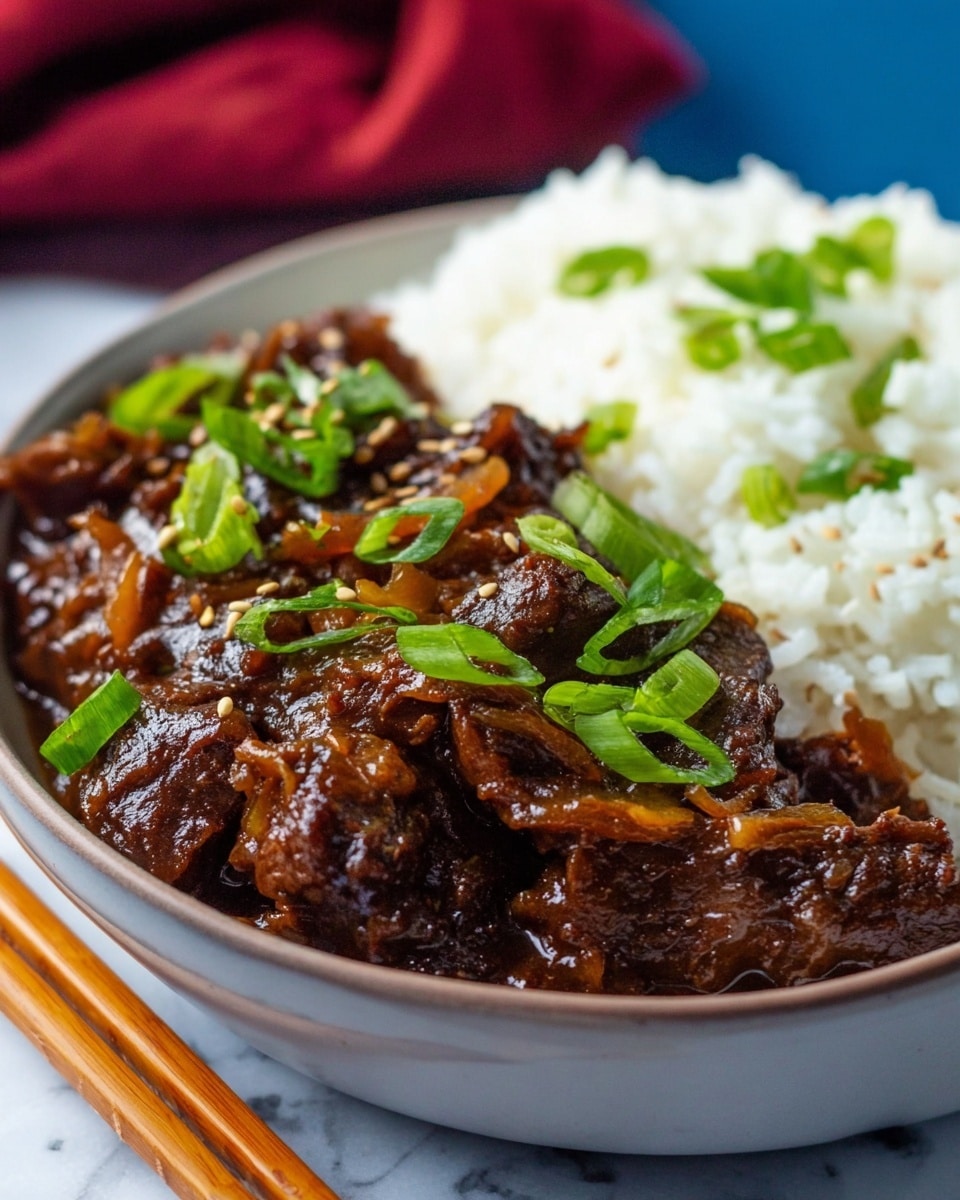 A close-up image showing a bowl filled with two main layers: on the left, a thick, dark brown beef stew with visible chunks of tender meat and cooked onions covered in a glossy sauce, garnished with chopped bright green spring onions and sprinkled with sesame seeds; on the right, a fluffy pile of white rice with some scattered green spring onions on top, the bowl itself is white, sitting on a white marbled surface with a pair of wooden chopsticks resting on the edge and a blurred background with blue and red tones. Photo taken with an iphone --ar 4:5 --v 7